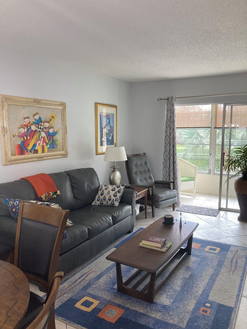 living room with door to screened/glassed in porch