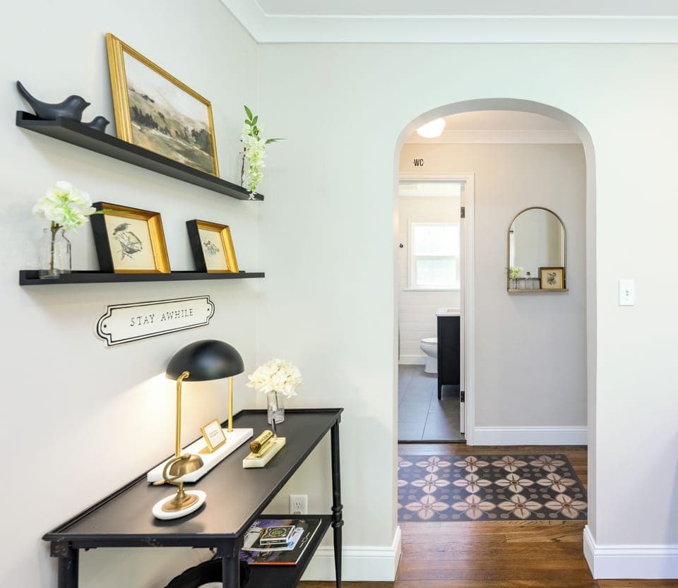 Arched doorway leading into the hallway, 2 private bedrooms and bathroom.