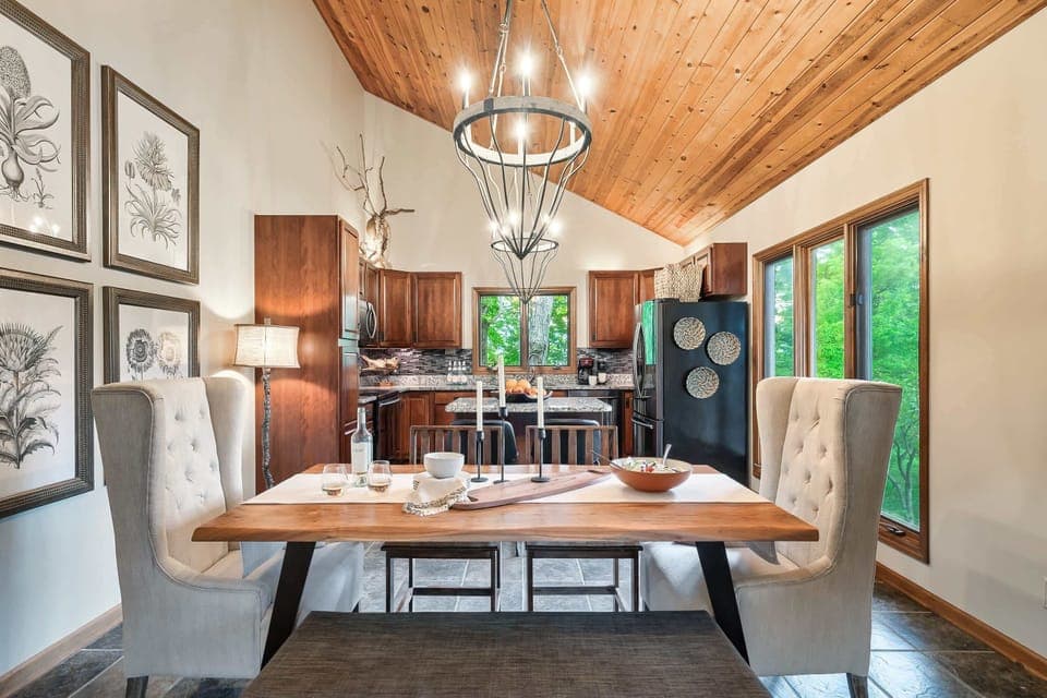 Kitchen and Dining Space with dining table and bar seating.