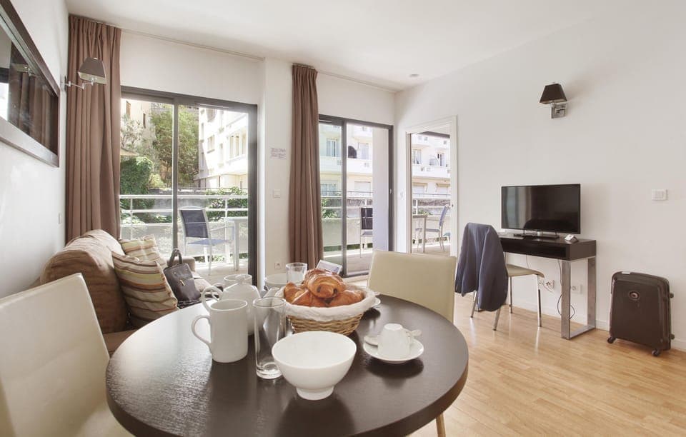 Bright living area with access to a private balcony — ideal for relaxing or enjoying a coffee outdoors.