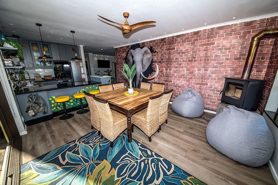 Dining area with fireplace and kitchen