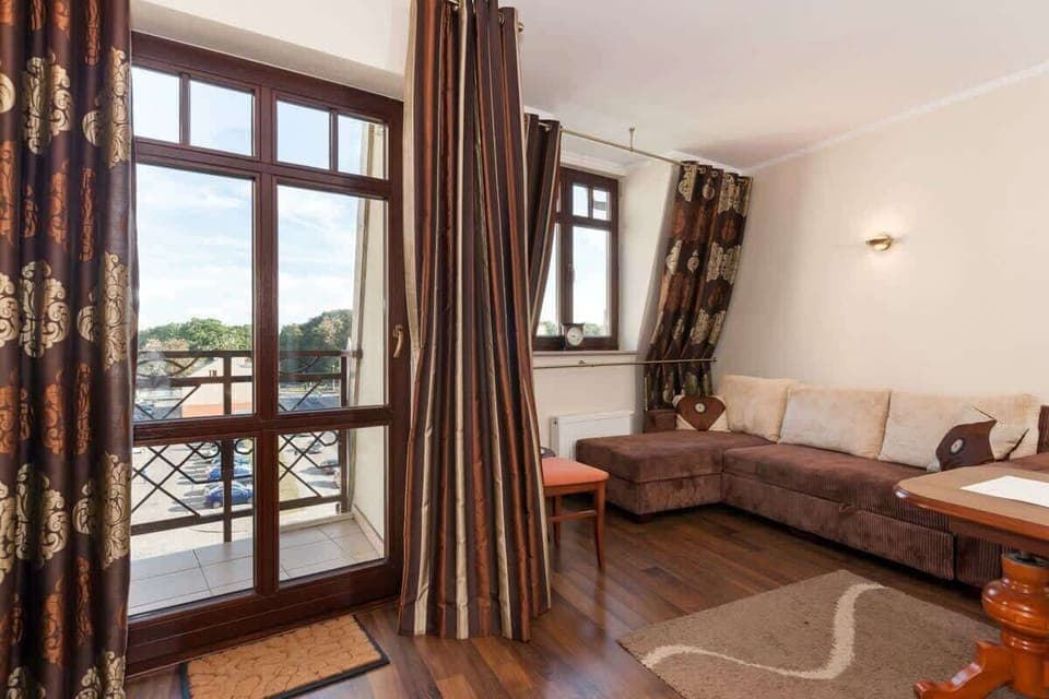 Living room of holiday apartment Pod Orłami 14/15 with a sofa