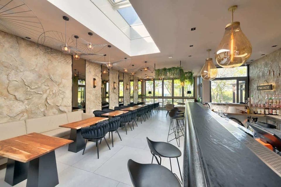 A bright restaurant space with natural light and industrial accents.