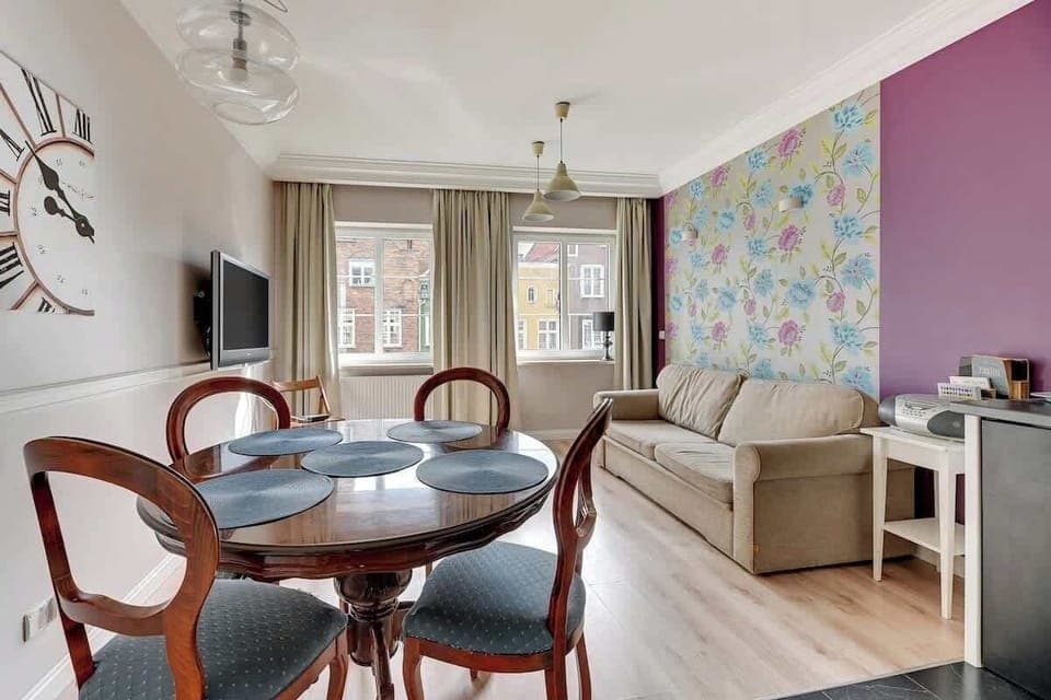 Cozy interior in muted colors with a traditional dining table.