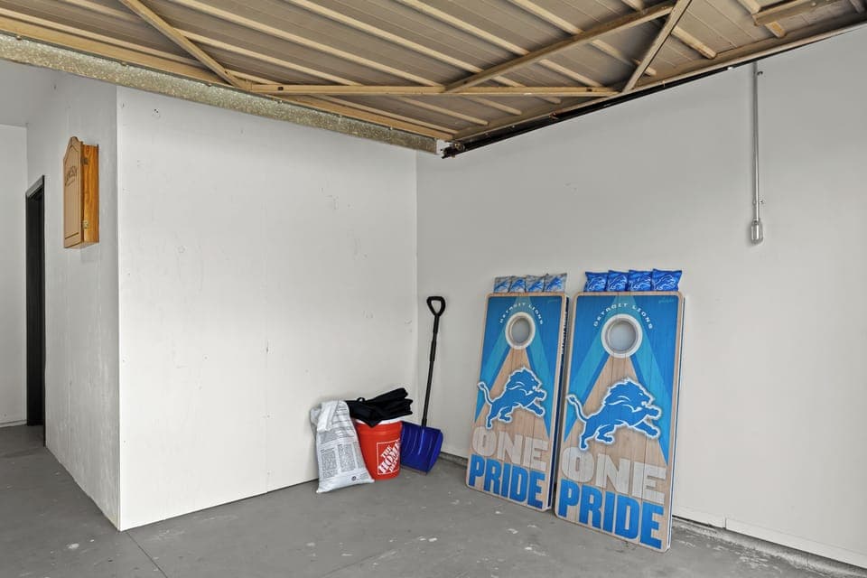 Cornhole boards and bean bags provided for backyard or garage tournaments.