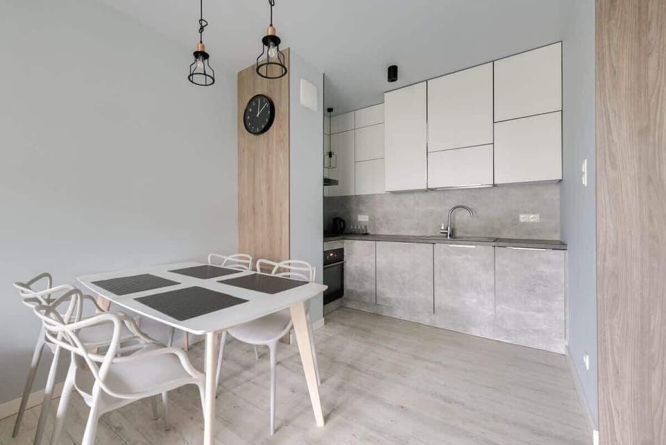 Stylishly decorated space with a dining table and chairs, perfect for shared meals.