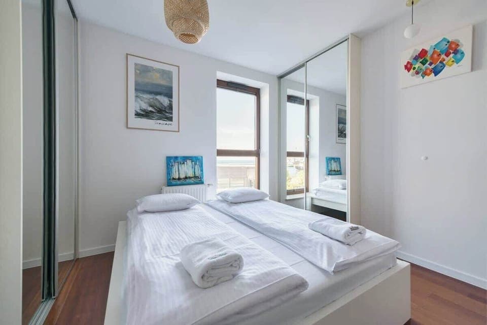 A detailed look at the bedroom, emphasizing the bright and airy atmosphere, ideal for restful nights.