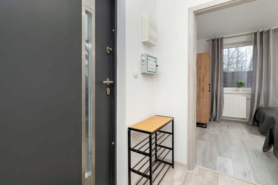 Bright hallway from which doors lead to other rooms.