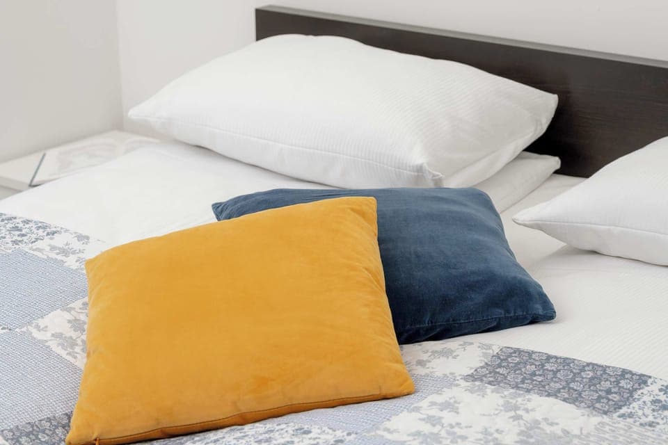 The bedroom's modern design ensures a comfortable stay.