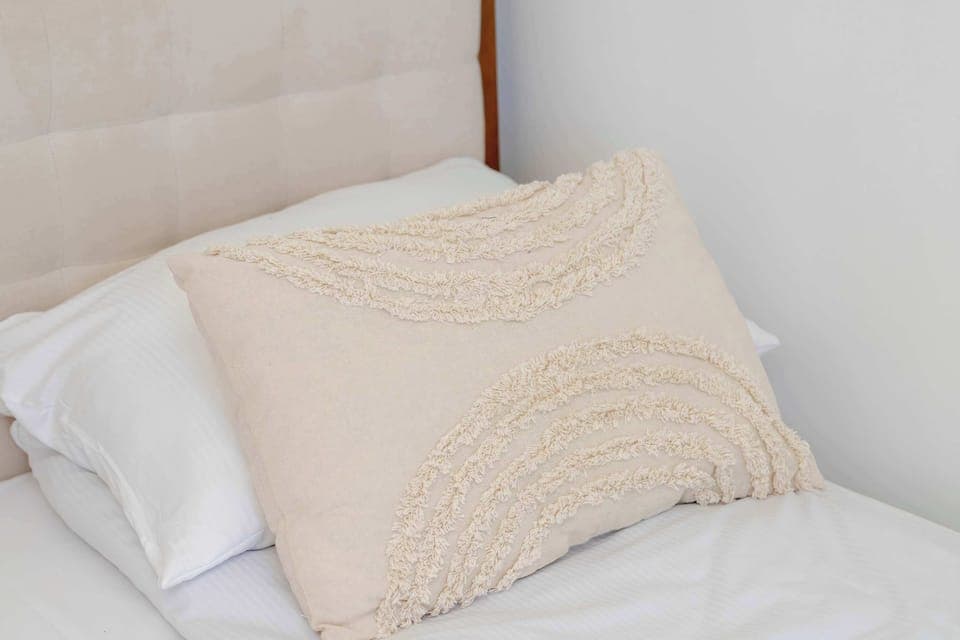 Decorative cushion on the bed.