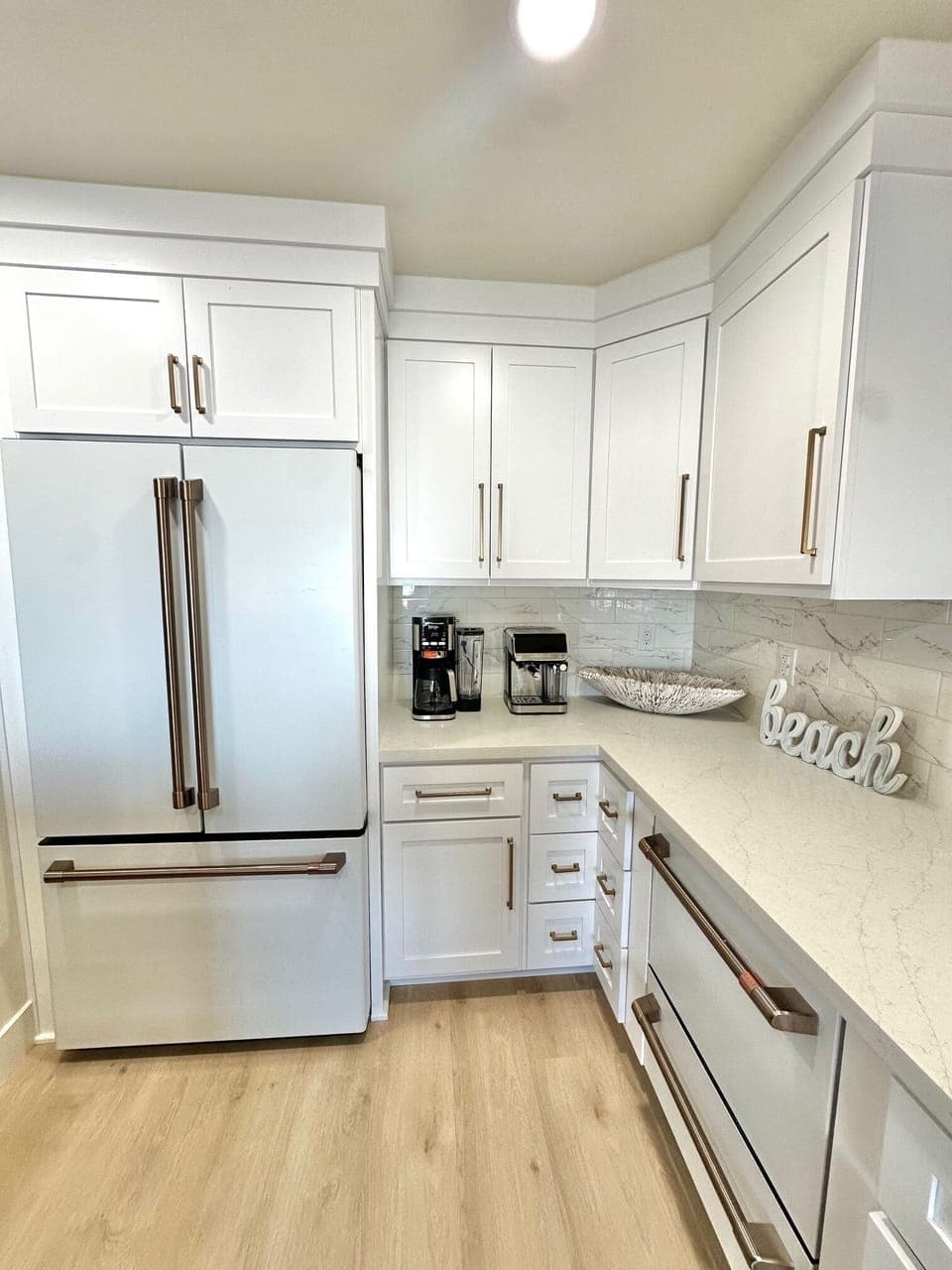 New, modern kitchen with Cafe' matte white appliances