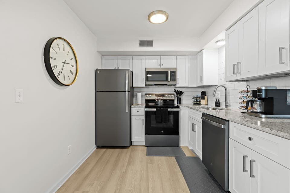 Fully equipped kitchen with stainless steel appliances and everything you need to cook at home.