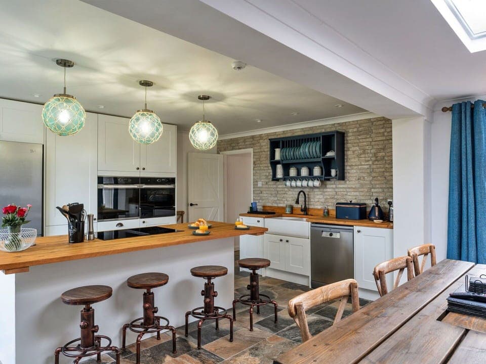 Furniture, Interior Design, Flooring, Kitchen, Cabinetry, Countertop, Light Fixture, Wood, Ceiling, Floor