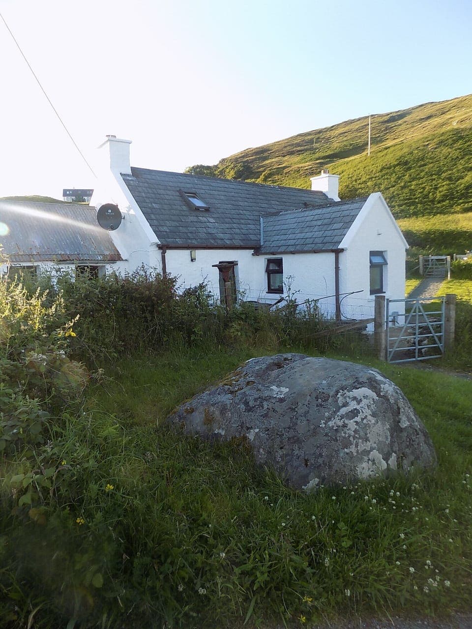 View of the cottage and the 'fairy stone'.