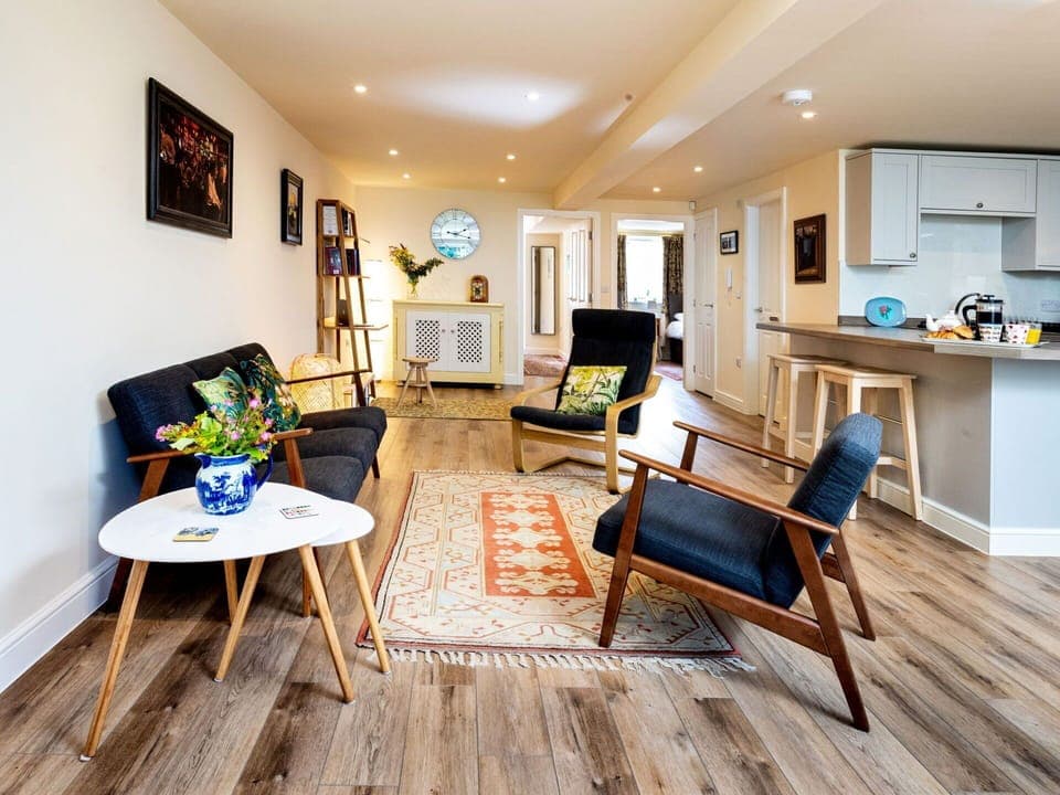 Furniture, Interior Design, Flooring, Floor, Couch, Wood Flooring, Wall, Living Room, Wood, Chair