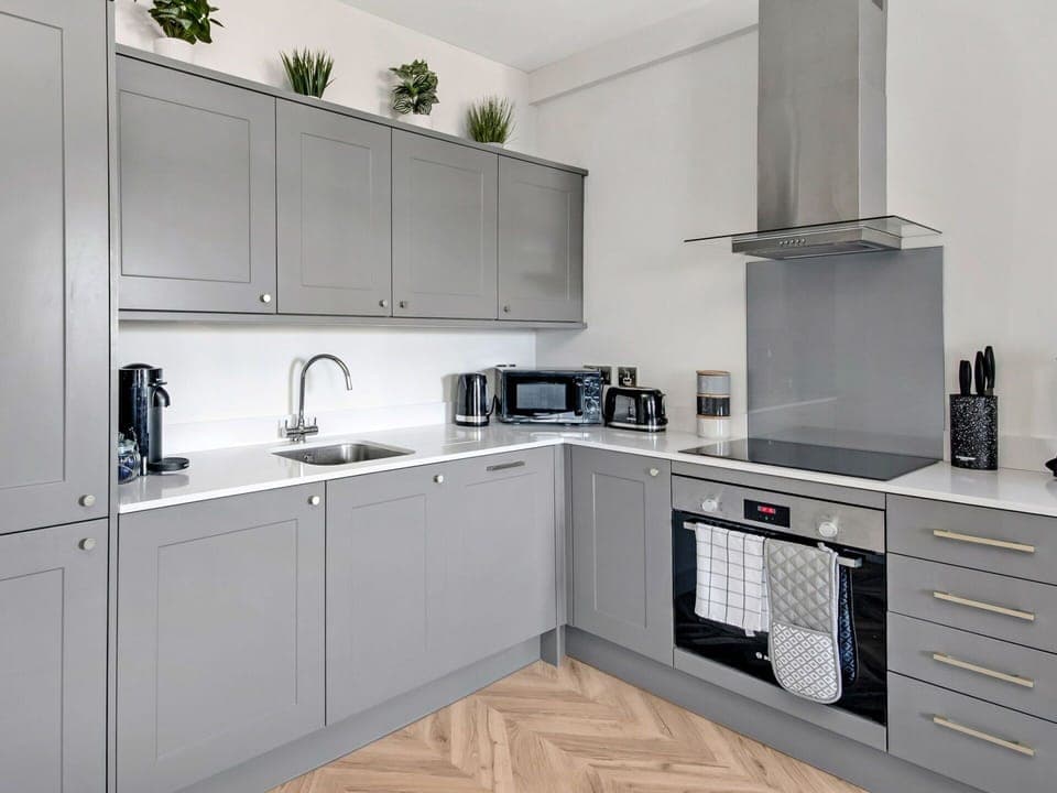 Kitchen, Flooring, Kitchen Appliance, Cabinetry, Wood, Major Appliance, Furniture, Interior Design, Countertop, Floor