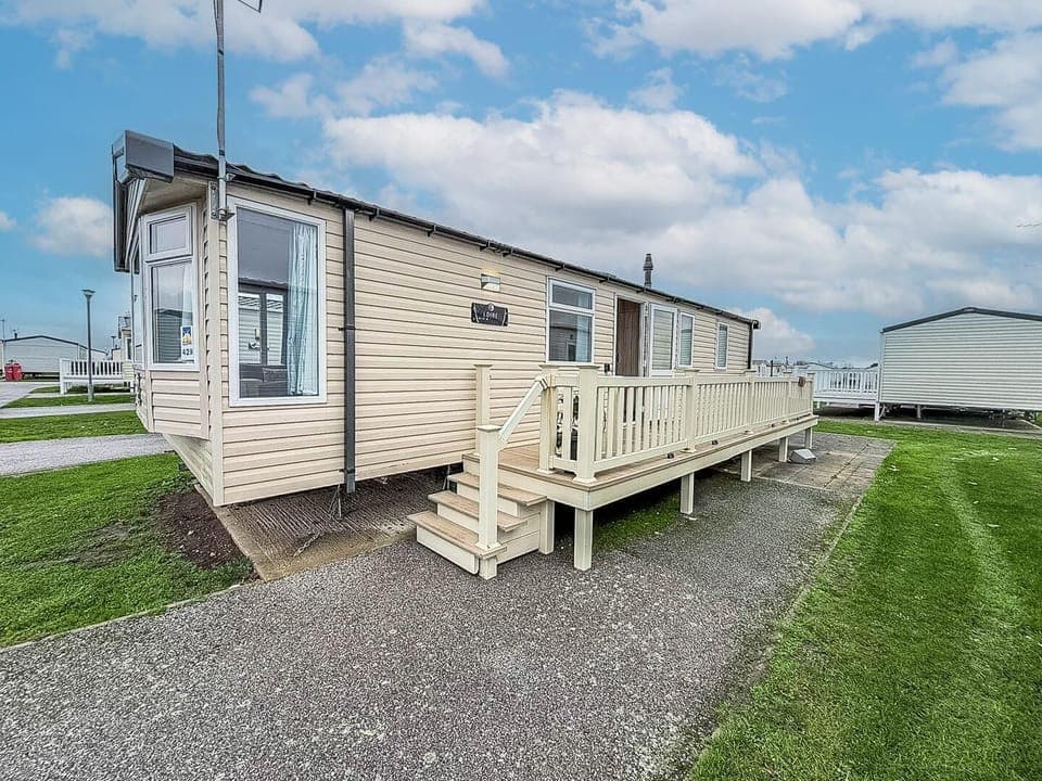 Cozy exterior with spacious deck for outdoor relaxation