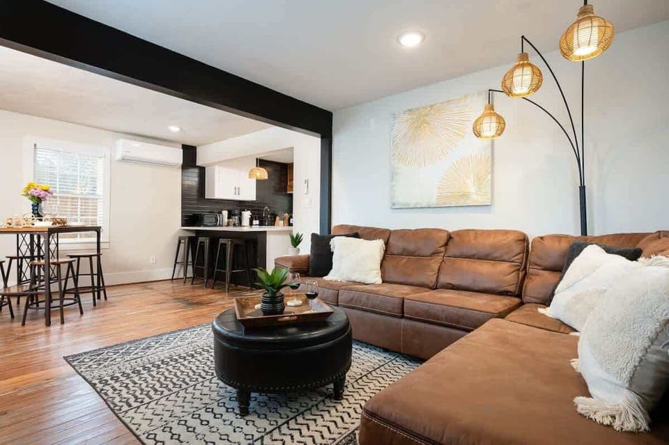 Back House Living Room: Stylish space with chic decor, inviting seating, and open kitchen vibe!