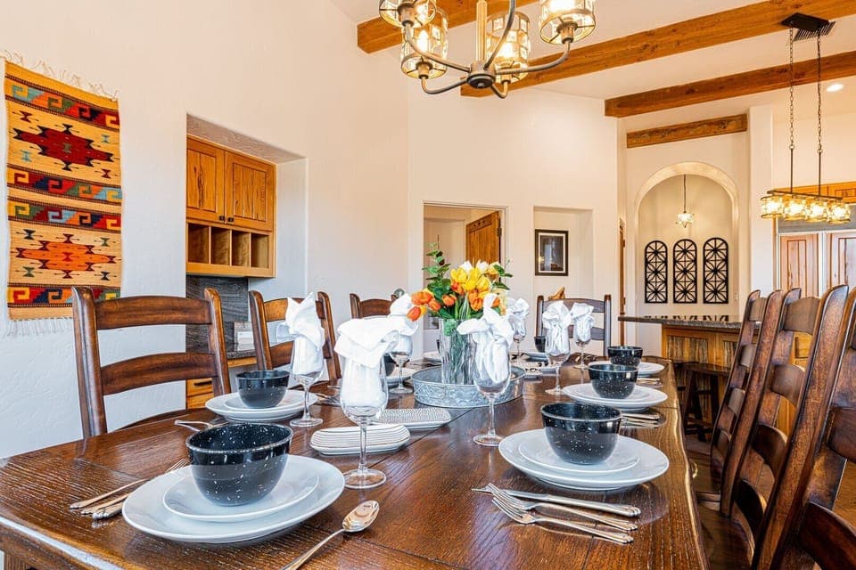 Dining table seats 8 with added leaf to extend for 12 guests