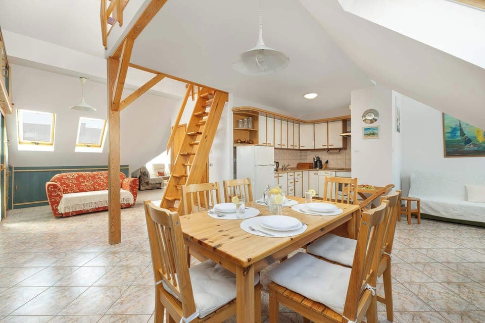 The large wooden table will accommodate 6 people and will be conducive to evening chats.