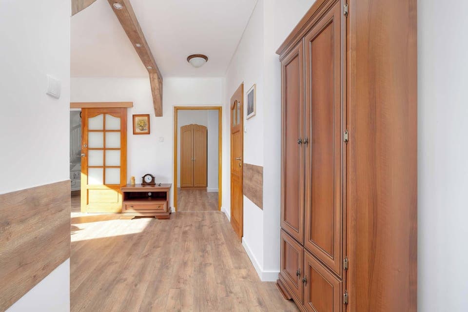 Apartment corridor with practical wardrobe.