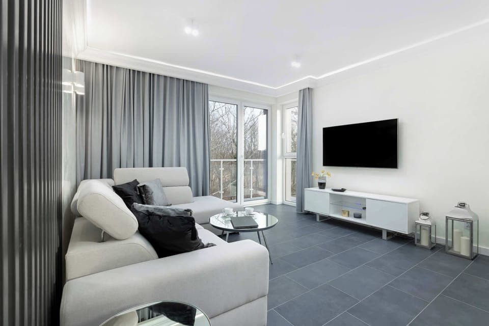 Living room with a comfortable sofa and TV. 