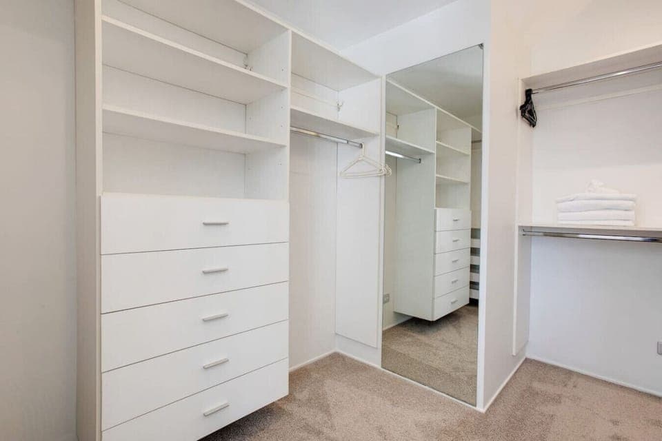 There is plenty of storage in the walk-in wardrobe in the main bedroom.