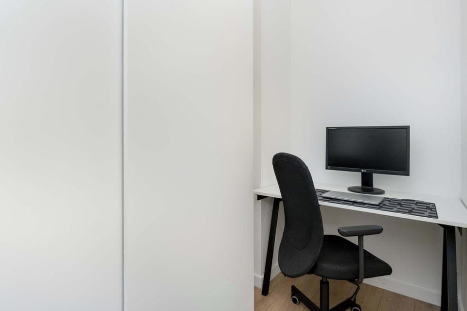 Enjoy the simplicity and comfort of the bedroom's modern design.