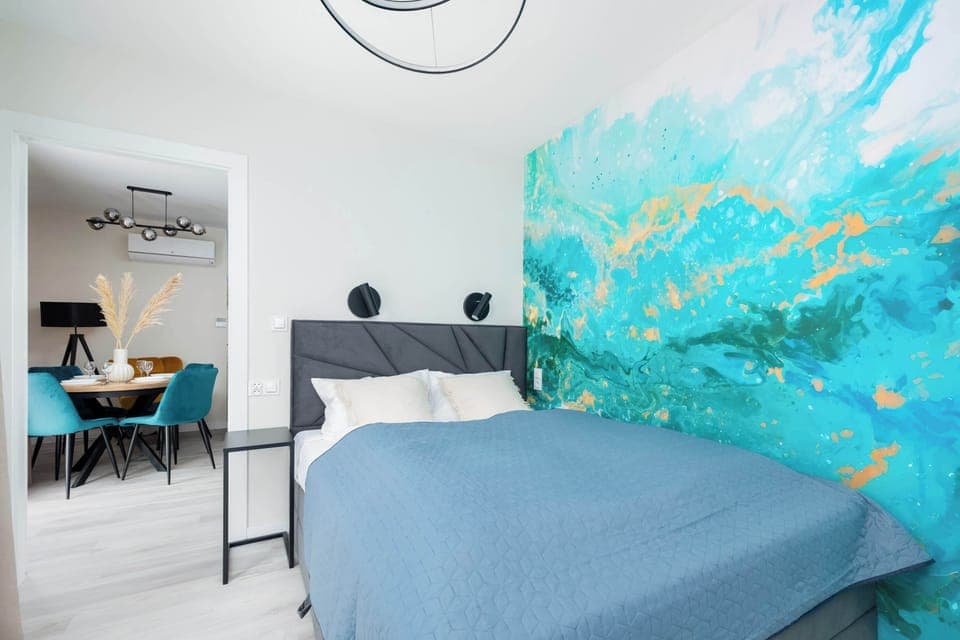 The bedroom's bright and functional space is ideal for unwinding. 