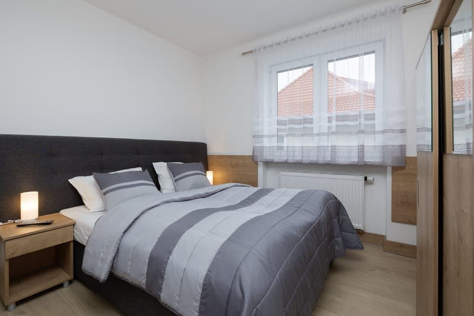 Relax in the elegant living area with a comfortable sofa and cozy decor.