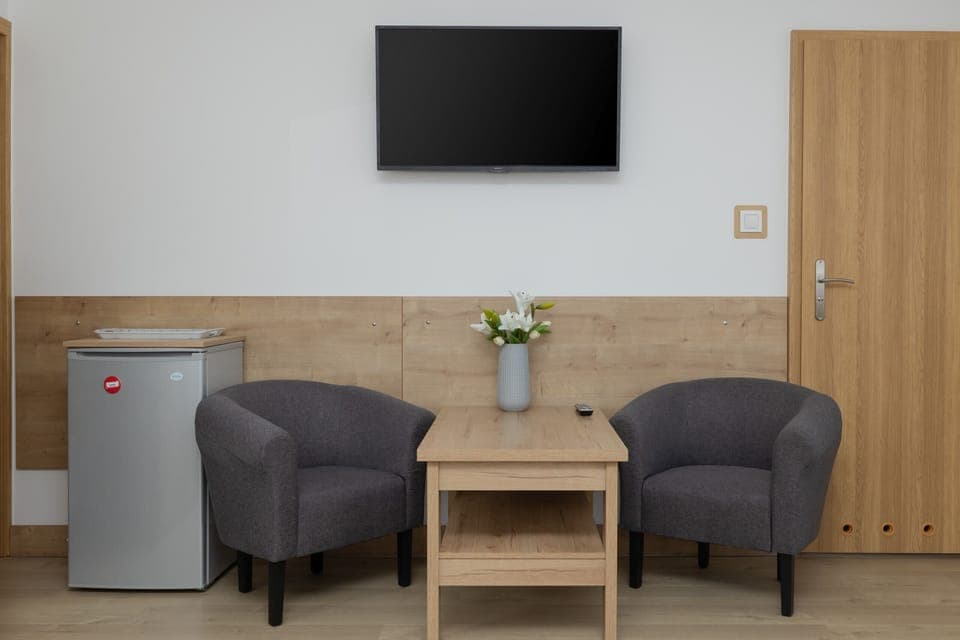 Living area with table, which is perfect both for eating a snack and remote work.