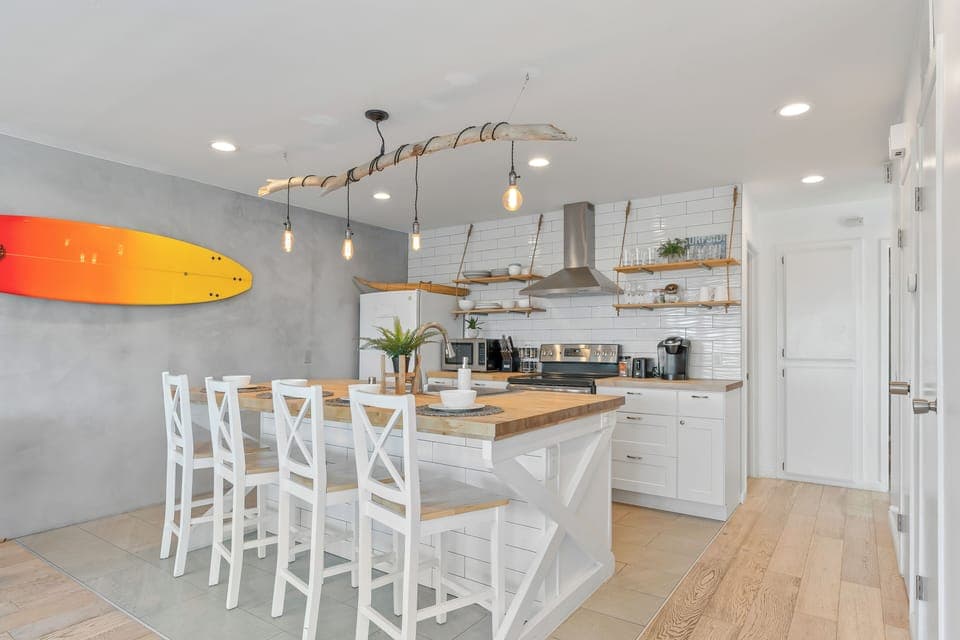 Unit B modern kitchen with barstool seating.