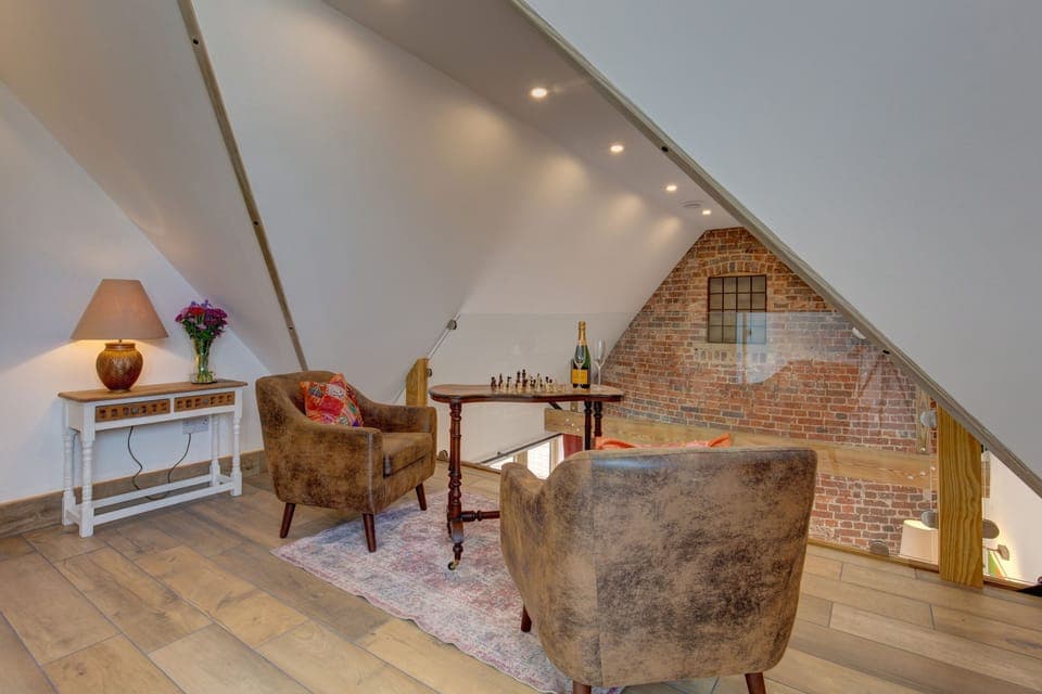 First floor: A seating area overlooking the sitting room below