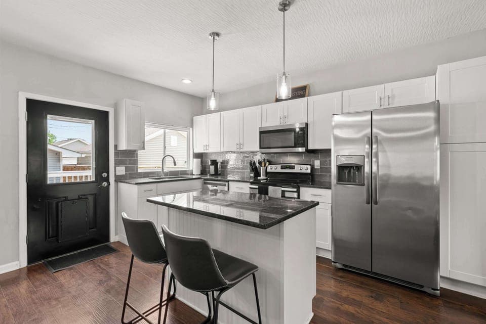 The sleek, open kitchen offers ample space & all the comforts of home​