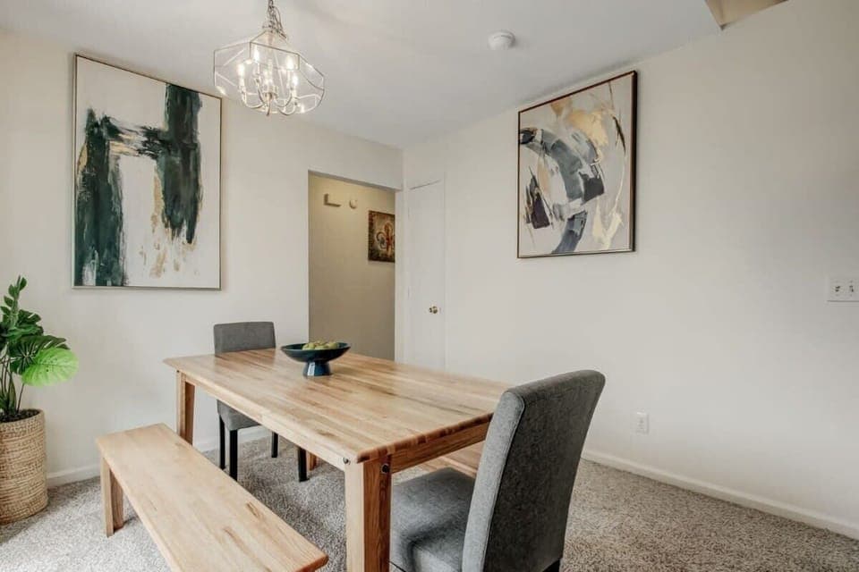 Bright dining space with elegant chandelier lighting.