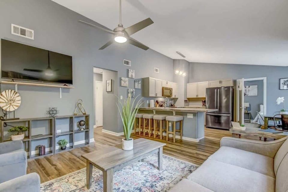 Open-concept living and dining space with contemporary furnishings and plenty of natural light.