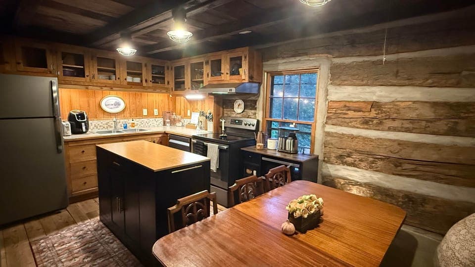 The kitchen and dining area complete with coffee station, microwave, air fryer, and range.