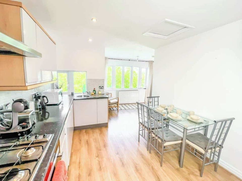 A stylish and functional space designed for enjoying meals, featuring a dining table and comfortable seating.