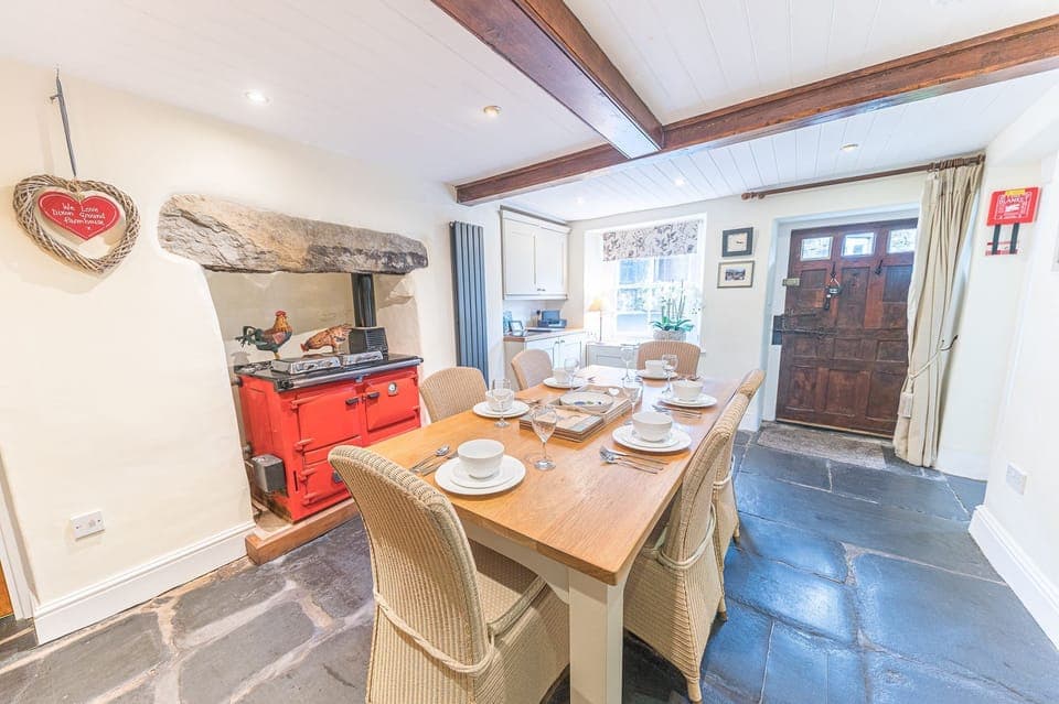 Dixon Ground Farm dining room with flag stone floor and table for 6