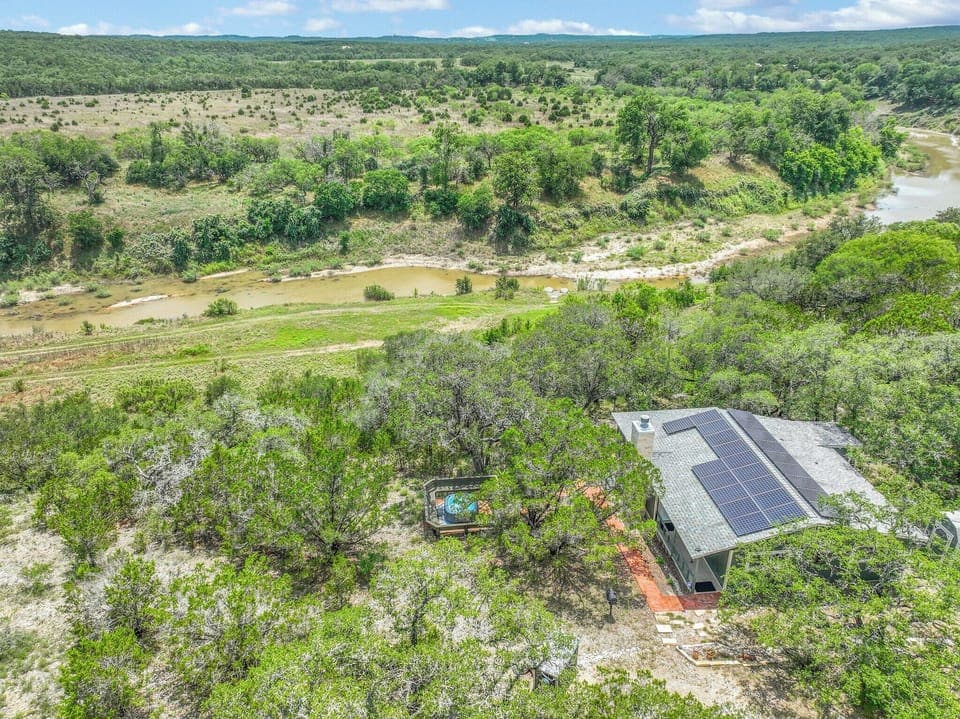 Aerial view of property overlooking Guadalupe River and Hill Country in the distance