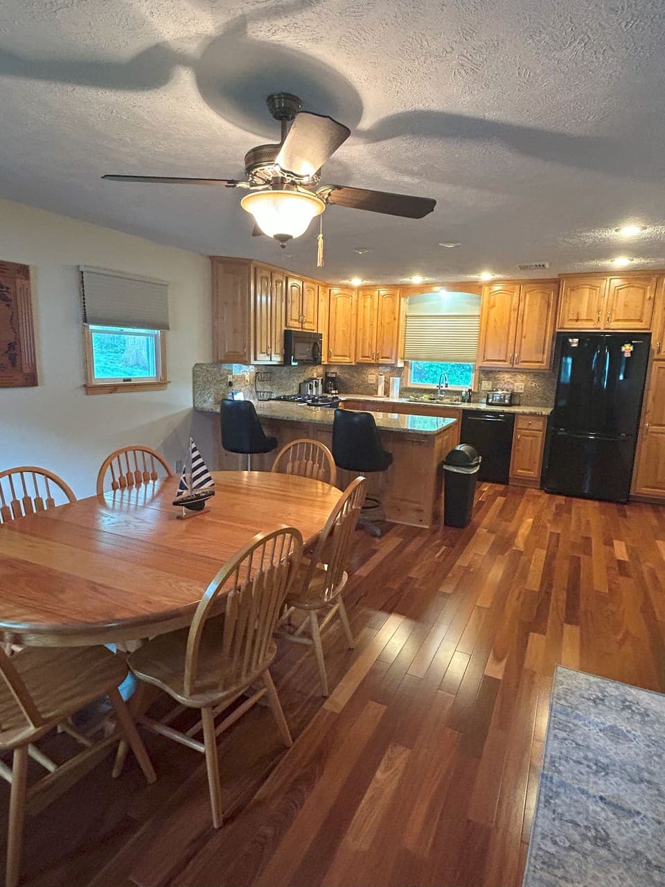 Large dining room adjourns large, fully stocked kitchen