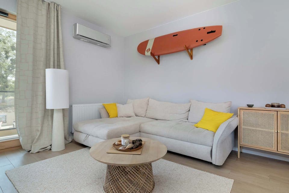 The stylish bedroom includes a comfortable sofa bed.