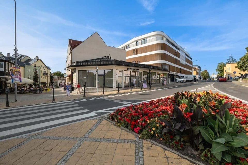 Modern building of the facility and the surrounding streets.