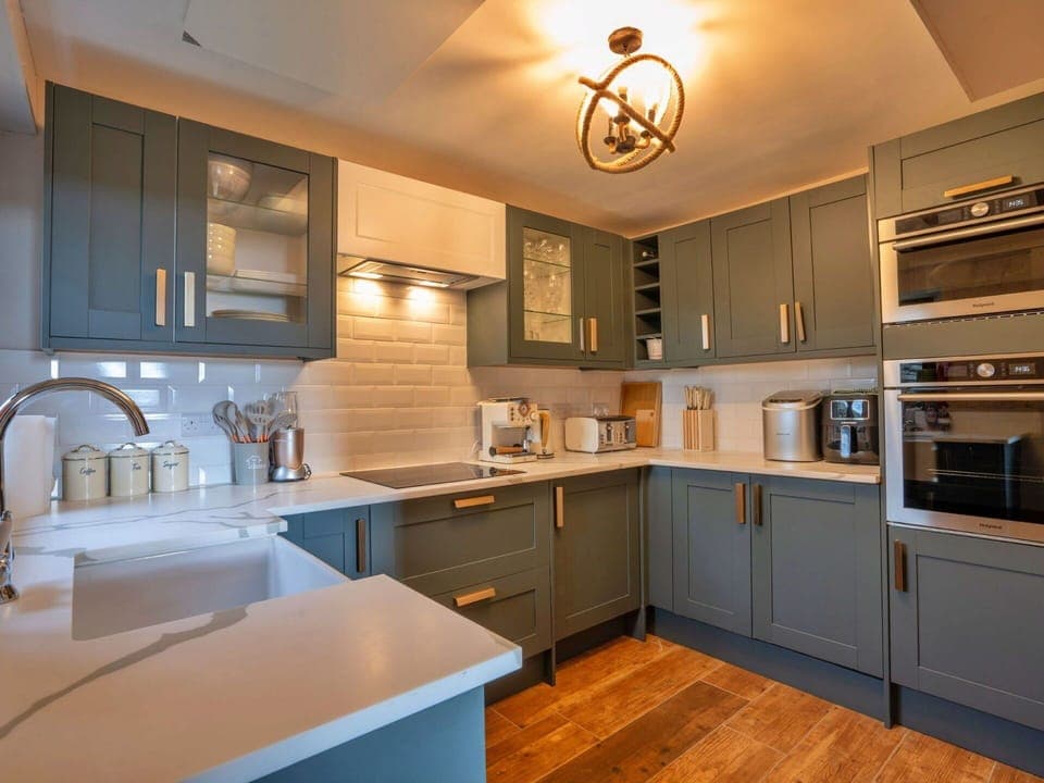 Kitchen, Cabinetry, Countertop, Interior Design, Kitchen Appliance, Wood, Flooring, Furniture, Major Appliance, Ceiling