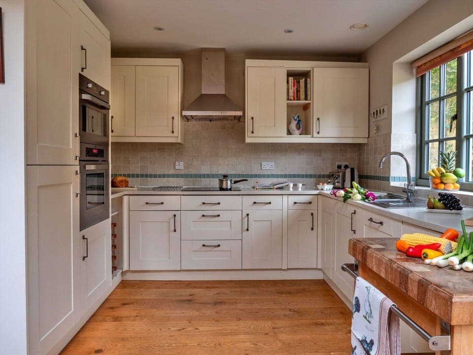 Furniture, Kitchen, Kitchen Appliance, Countertop, Cabinetry, Flooring, Interior Design, Major Appliance, Wood, Drawer