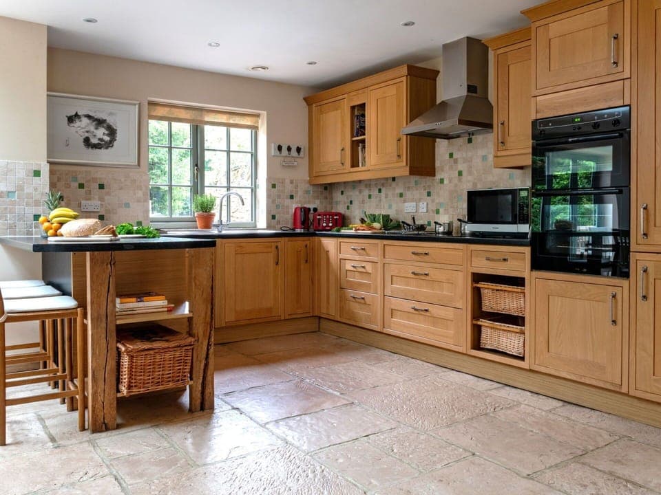 Furniture, Kitchen, Countertop, Cabinetry, Flooring, Interior Design, Kitchen Appliance, Floor, Wood, Drawer