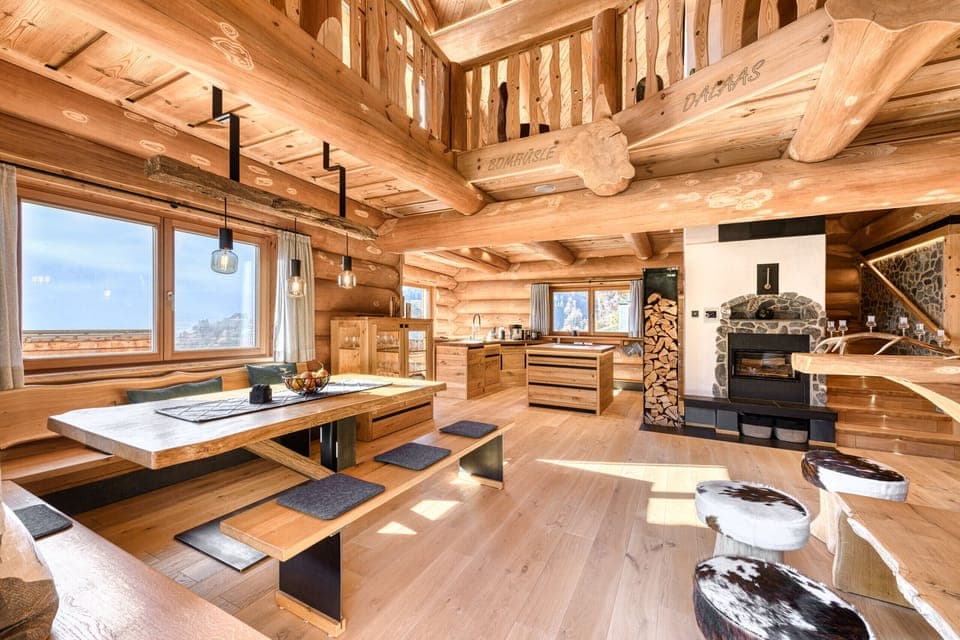 Chalet Bomhüsle in Dalaas in the Klostertal valley with a large dining table.