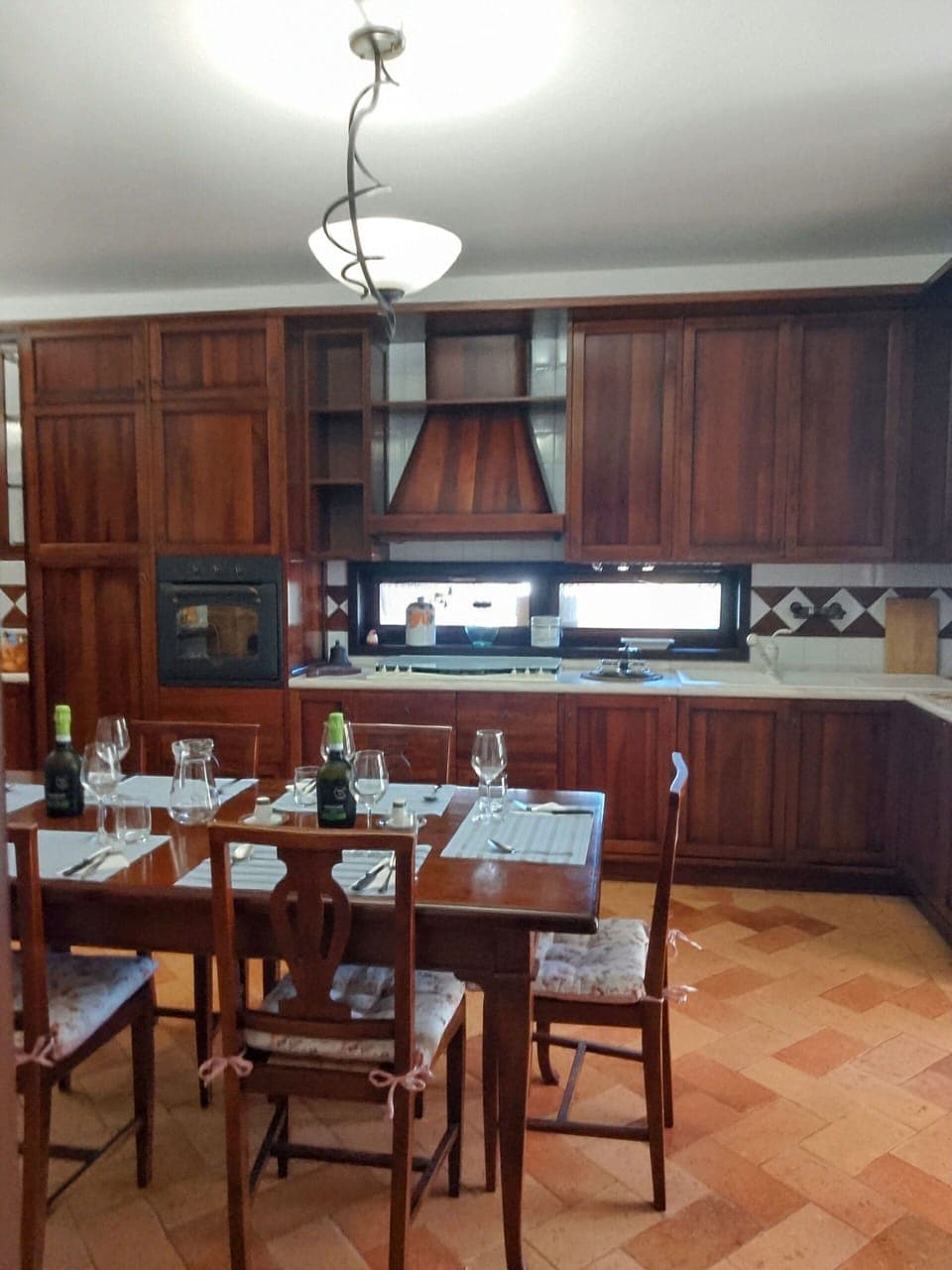 Furniture, Flooring, Interior Design, Wood, Cabinetry, Floor, Lighting, Light Fixture, Kitchen, Countertop