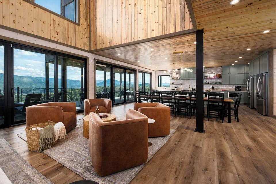 Living room with expansive mountain views and multiple seating areas