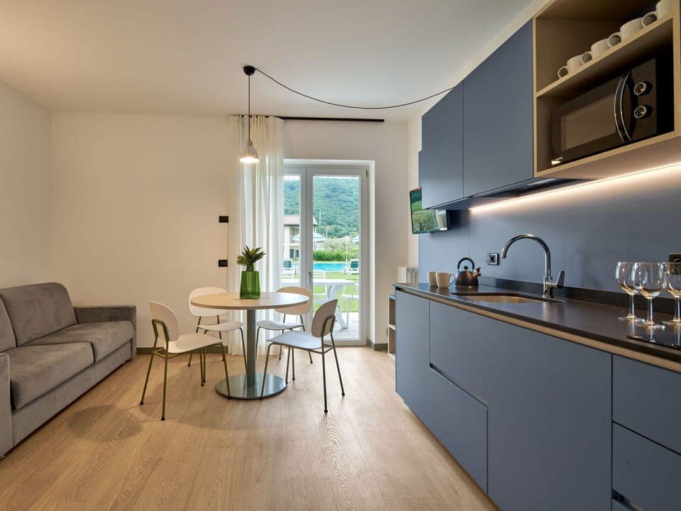 Interior Design, Furniture, Flooring, Countertop, Kitchen, Ceiling, Floor, Room, Cabinetry, Lighting